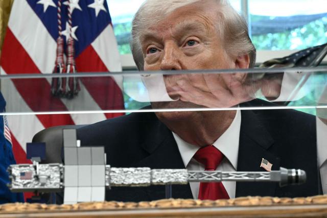 US President Donald Trump speaks as he welcomes the Artemis II astronauts in the Oval Office at the White House in Washington, DC, on April 29, 2026. (Photo by Brendan SMIALOWSKI / AFP)