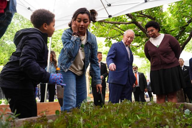 Britain's King Charles III views a flower bed during a visit to Harlem Grown, a local community organisation and after-school initiative, in New York on April 29, 2026. (Photo by Aaron Chown / POOL / AFP)