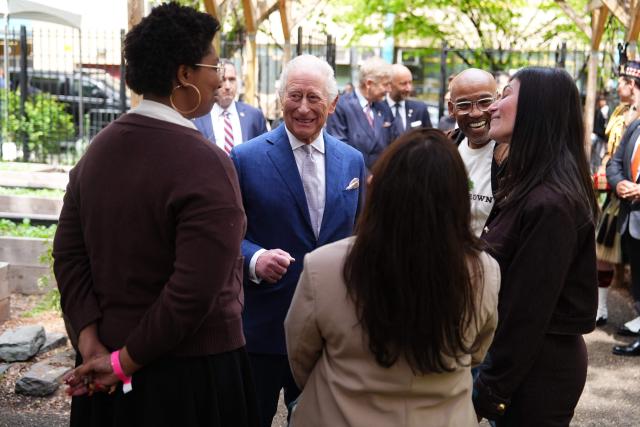 King Charles III with founder Tony Hilliery (2nd R) during a visit to Harlem Grown, a local community organisation and after-school initiative, in New York on April 29, 2026. (Photo by Aaron Chown / POOL / AFP)