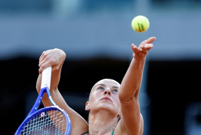 Ukraine's Marta Kostyuk serves against Czech Republic's Linda Noskova during their 2026 WTA Tour Madrid Open tennis tournament  quarter-final singles match at the Caja Magica in Madrid, on April 29, 2026. (Photo by OSCAR DEL POZO / AFP)
