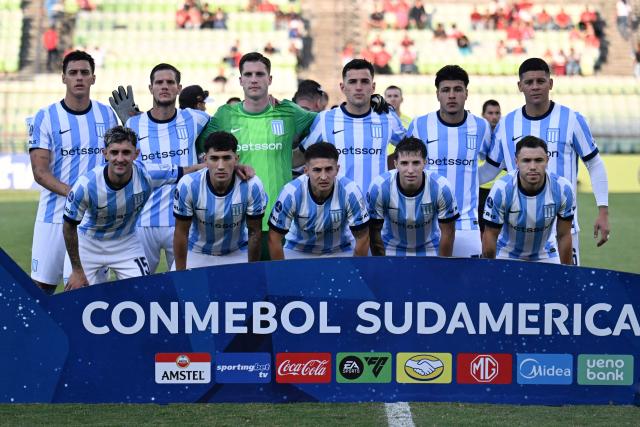 Racing players pose for a picture before the start of the Copa Sudamericana group stage football match between Venezuela's Caracas FC and Argentina's Racing Club at the Olimpico de la UCV stadium in Caracas on April 29, 2026. (Photo by Juan BARRETO / AFP)