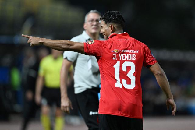Caracas' defender #13 Jesus Yendis celebrates scoring his team's first goal during the Copa Sudamericana group stage football match between Venezuela's Caracas FC and Argentina's Racing Club at the Olimpico de la UCV stadium in Caracas on April 29, 2026. (Photo by Juan BARRETO / AFP)