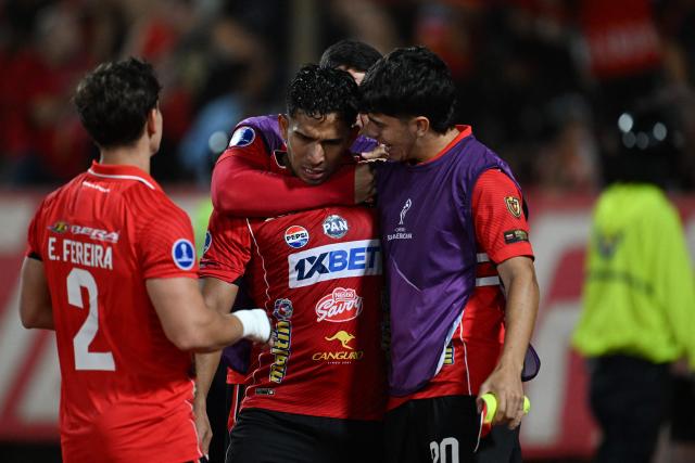 Caracas' defender #13 Jesus Yendis celebrates scoring his team's first goal during the Copa Sudamericana group stage football match between Venezuela's Caracas FC and Argentina's Racing Club at the Olimpico de la UCV stadium in Caracas on April 29, 2026. (Photo by Juan BARRETO / AFP)