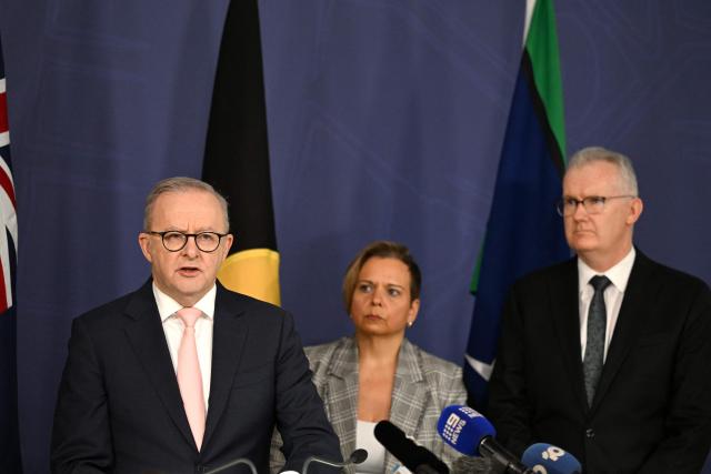 Australia's Prime Minister Anthony Albanese (L) speaks on the Royal Commission on last year's mass shooting incident where two gunmen killed 15 people at Australia's Bondi Beach, while Attorney-General Michelle Rowland (C) and Home Affairs Minister Tony Burke (R) look on during a press conference in Sydney on April 30, 2026. Australia should bolster security at Jewish events and review key counter-terrorism teams in the wake of last year's antisemitic mass shooting at Bondi Beach, a high-powered inquiry found on April 30. (Photo by Saeed KHAN / AFP)