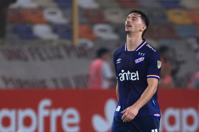 Nacional's forward #11 Maximiliano Silvera reacts after conceding a goal during the Copa Libertadores group stage football match between Peru's Universitario and Uruguay's Nacional at the Monumental "U" Marathon stadium in Lima on April 29, 2026. (Photo by Connie FRANCE / AFP)