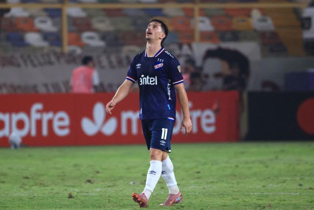 Nacional's forward #11 Maximiliano Silvera reacts after conceding a goal during the Copa Libertadores group stage football match between Peru's Universitario and Uruguay's Nacional at the Monumental "U" Marathon stadium in Lima on April 29, 2026. (Photo by Connie FRANCE / AFP)