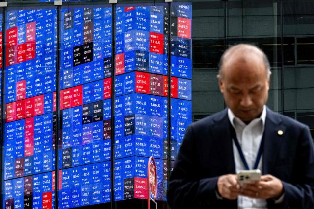 An electronic quotation board displays the Nikkei 225 stock prices on the Tokyo Stock Exchange in Tokyo on April 30, 2026. (Photo by Philip FONG / AFP)