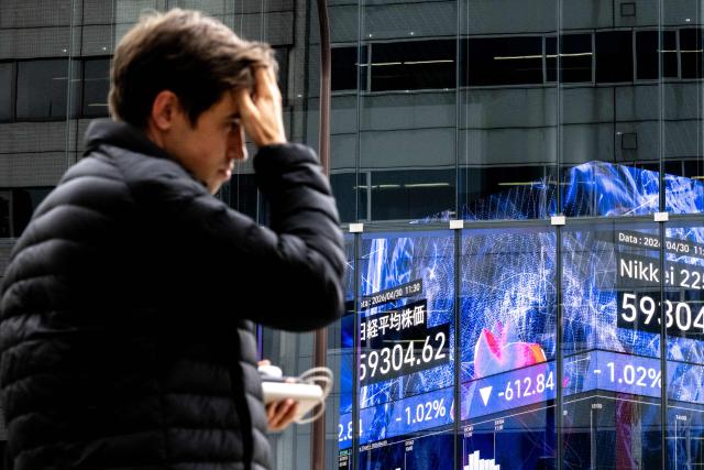An electronic quotation board displays the Nikkei 225 index on the Tokyo Stock Exchange in Tokyo on April 30, 2026. (Photo by Philip FONG / AFP)