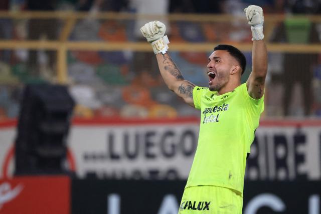 Universitario's Chilean goalkeeper #25 Miguel Vargas celebrates after winning the Copa Libertadores group stage football match between Peru's Universitario and Uruguay's Nacional at the Monumental "U" Marathon stadium in Lima on April 29, 2026. (Photo by Connie FRANCE / AFP)