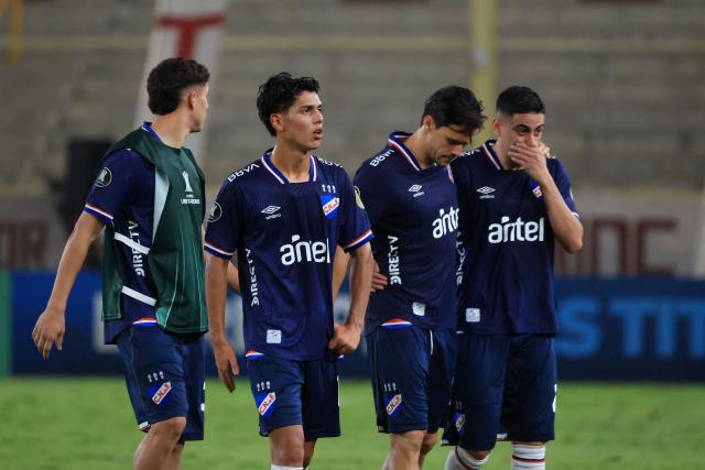 Players of Nacional react after losing the Copa Libertadores group stage football match between Peru's Universitario and Uruguay's Nacional at the Monumental "U" Marathon stadium in Lima on April 29, 2026. (Photo by Connie FRANCE / AFP)