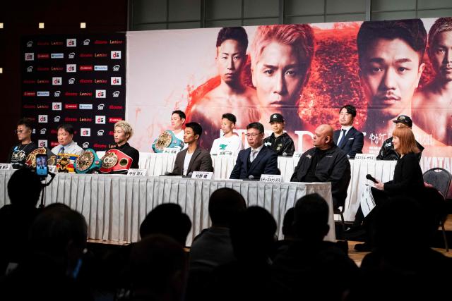 Japanese boxer Naoya Inoue (front 3rd L), the current unified WBA, WBC, IBF, and WBO world superbantamweight champion, and his compatriot Junto Nakatani (front center) attend a press conference ahead of their May 2 boxing match, in Tokyo on April 30, 2026. (Photo by Yuichi YAMAZAKI / AFP)