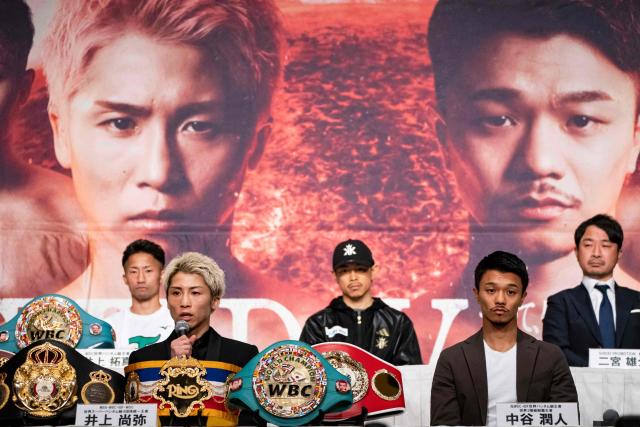Japanese boxer Naoya Inoue (front L), the current unified WBA, WBC, IBF, and WBO world superbantamweight champion, and his compatriot Junto Nakatani (front R) attend a press conference ahead of their May 2 boxing match, in Tokyo on April 30, 2026. (Photo by Yuichi YAMAZAKI / AFP)