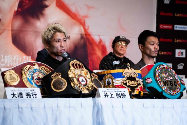 Japanese boxer Naoya Inoue (L), the current unified WBA, WBC, IBF, and WBO world superbantamweight champion, and his compatriot Junto Nakatani (R) attend a press conference ahead of their May 2 boxing match, in Tokyo on April 30, 2026. (Photo by Yuichi YAMAZAKI / AFP)
