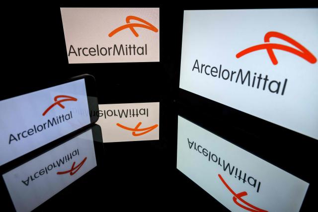 (FILES) This photograph shows screens displaying the logo of the company ArcelorMittal, listed on the CAC 40, the main stock market index of the Paris Stock Exchange, in Toulouse on March 31, 2026. Steelmaker ArcelorMittal announced on April 30, 2026 that its turnover rose by 4.4% to $15.4 billion (Ђ13.2 billion) in the first quarter, but its net profit fell compared with the first three months of 2025. (Photo by Lionel BONAVENTURE / AFP)