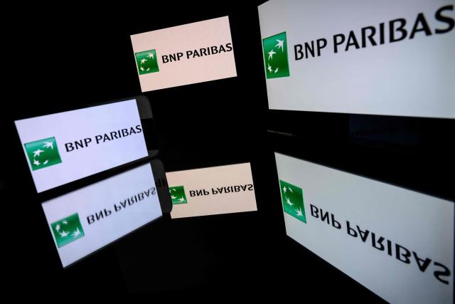 (FILES) This illustrative photograph shows screens displaying the logo of the French company BNP Paribas, listed on the CAC 40, the main stock market index of the Paris Stock Exchange, in Toulouse on March 31, 2026. French banking giant BNP Paribas announced on April 30, 2026 that it had made a record net profit of Ђ3.2 billion in the first quarter, up 9%, driven by operational performance and the successful integration of asset manager Axa IM, acquired in 2025. (Photo by Lionel BONAVENTURE / AFP)