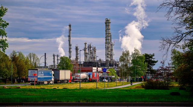 A general overview taken on April 30, 2026 shows an entry gate to the PCK refinery, which supplies oil to Berlin and the surrounding region, in Schwedt, northeastern Germany. Germany has learned that Russia plans to halt the flow of Kazakh oil through the Druzhba pipeline to the PCK refinery in eastern Germany starting May 1, 2026 the energy ministry in Berlin told AFP on April 22, 2026. The move comes amid Russia's war against Ukraine and a global energy crisis linked to the US-Israeli war against Iran, which has caused major disruptions to global oil and gas markets. The PCK refinery near the Polish border supplies much of the Berlin region with fuel, but the German energy ministry voiced confidence the impact would be limited. (Photo by Tobias SCHWARZ / AFP)