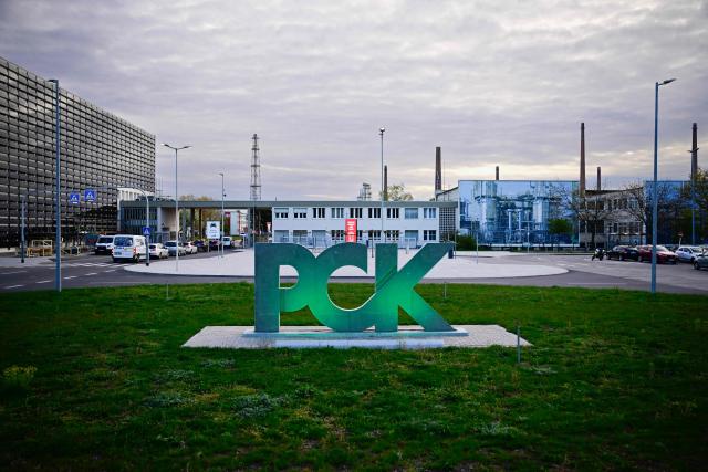 The logo of the PCK Schwedt refinery in Schwedt, northeastern Germany, is seen at the company's plant on April 30, 2026, one day before Russia will halt the pipeline flow of Kazakh oil to Germany, citing technical reasons. The stoppage from May 1, 2026 will impact the PCK refinery, run by the German subsidiary of Russia's state-owned oil company Rosneft, that supplies much of the Berlin region and the capital's international airport with fuel. The move by Moscow comes amid Russia's war against Ukraine and a global energy crisis sparked by the US-Israeli war against Iran, which has caused major disruptions to global oil and gas markets. The German government stressed it does not expect an energy supply crunch. (Photo by Tobias SCHWARZ / AFP)