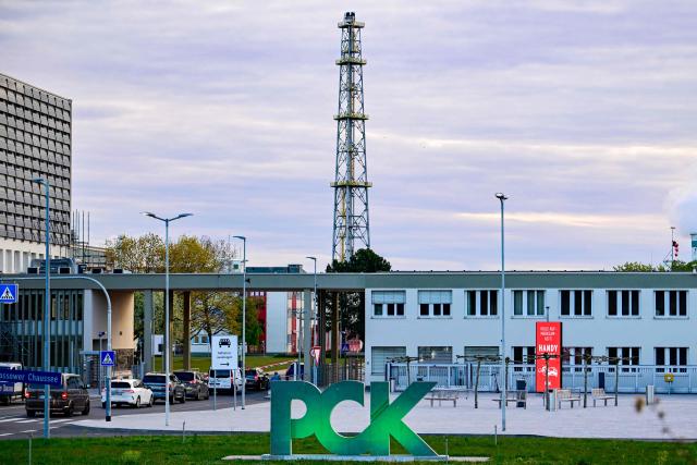 The logo of the PCK Schwedt refinery in Schwedt, northeastern Germany, is seen at the company's plant on April 30, 2026, one day before Russia will halt the pipeline flow of Kazakh oil to Germany, citing technical reasons. The stoppage from May 1, 2026 will impact the PCK refinery, run by the German subsidiary of Russia's state-owned oil company Rosneft, that supplies much of the Berlin region and the capital's international airport with fuel. The move by Moscow comes amid Russia's war against Ukraine and a global energy crisis sparked by the US-Israeli war against Iran, which has caused major disruptions to global oil and gas markets. The German government stressed it does not expect an energy supply crunch. (Photo by Tobias SCHWARZ / AFP)