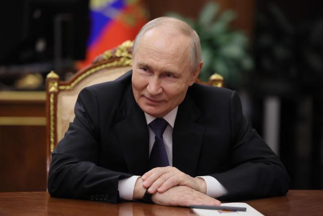 In this pool photograph distributed by the Russian state agency Sputnik, Russia's President Vladimir Putin meets with Chechen leader at the Kremlin in Moscow late on April 29, 2026. (Photo by Mikhail METZEL / POOL / AFP) / Editor's note : this image is distributed by the Russian state owned agency Sputnik