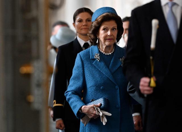 Queen Silvia of Sweden arrives followed by Crown Princess Victoria of Sweden (L) at the Royal Chapel inside the Palace in Stockholm, Sweden, on April 30, 2026, to attend the "Te Deum" thanksgiving service during celebrations to mark the 80th birthday of Sweden's King Carl XVI Gustaf. (Photo by Jonathan Nackstrand / AFP)