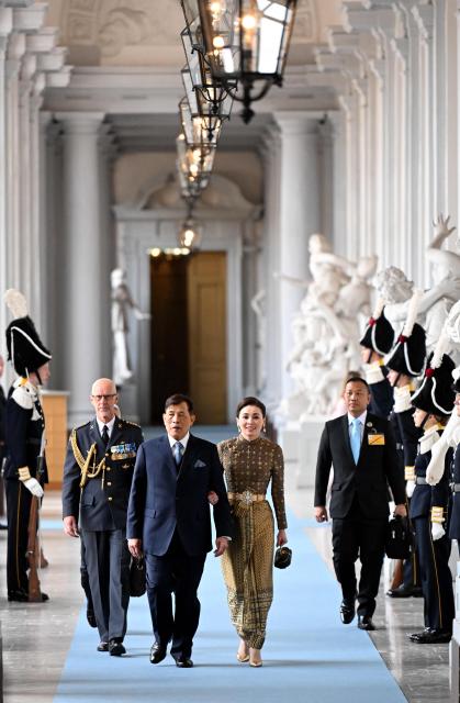 Thai King Rama X (Maha Vajiralongkorn, C-L) and his wife Suthida Vajiralongkorn (C-R) arrive at the Royal Chapel inside the Palace in Stockholm, Sweden, on April 30, 2026, to attend the "Te Deum" thanksgiving service during celebrations to mark the 80th birthday of Sweden's King Carl XVI Gustaf. (Photo by Jonathan Nackstrand / AFP)