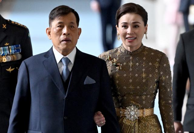 (ALTERNATIVE CROP) - Thai King Rama X (Maha Vajiralongkorn, L) and his wife Suthida Vajiralongkorn arrive at the Royal Chapel inside the Palace in Stockholm, Sweden, on April 30, 2026, to attend the "Te Deum" thanksgiving service during celebrations to mark the 80th birthday of Sweden's King Carl XVI Gustaf. (Photo by Jonathan Nackstrand / AFP) / ALTERNATE CROP