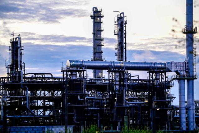 Partial view of the facilities of the PCK Schwedt refinery in Schwedt, northeastern Germany, are pictured  at the company's plant on early April 30, 2026, one day before Russia will halt the pipeline flow of Kazakh oil to Germany, citing technical reasons. The stoppage from May 1, 2026 will impact the PCK refinery, run by the German subsidiary of Russia's state-owned oil company Rosneft, that supplies much of the Berlin region and the capital's international airport with fuel. The move by Moscow comes amid Russia's war against Ukraine and a global energy crisis sparked by the US-Israeli war against Iran, which has caused major disruptions to global oil and gas markets. The German government stressed it does not expect an energy supply crunch. (Photo by Tobias SCHWARZ / AFP)