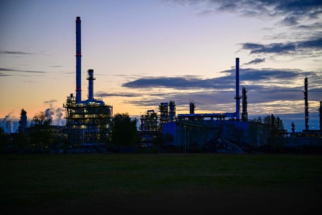 Towers of the facilities of the PCK Schwedt refinery in Schwedt, northeastern Germany, are pictured  at the company's plant on early April 30, 2026, one day before Russia will halt the pipeline flow of Kazakh oil to Germany, citing technical reasons. The stoppage from May 1, 2026 will impact the PCK refinery, run by the German subsidiary of Russia's state-owned oil company Rosneft, that supplies much of the Berlin region and the capital's international airport with fuel. The move by Moscow comes amid Russia's war against Ukraine and a global energy crisis sparked by the US-Israeli war against Iran, which has caused major disruptions to global oil and gas markets. The German government stressed it does not expect an energy supply crunch. (Photo by Tobias SCHWARZ / AFP)