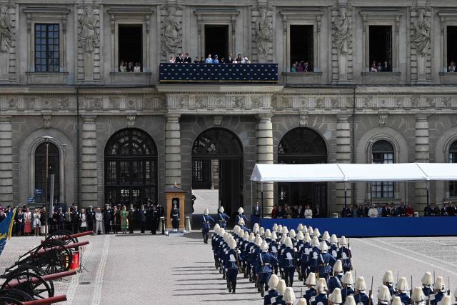 Mmebers of the Swedish royal family follow the changing of the guard from the balcony at the Royal Palace in Stockholm, Sweden, on April 30, 2026, during celebrations to mark the 80th birthday of Sweden's King Carl XVI Gustaf. (Photo by Jonathan Nackstrand / AFP)