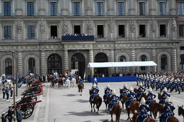 Mmebers of the Swedish royal family follow the changing of the guard from the balcony at the Royal Palace in Stockholm, Sweden, on April 30, 2026, during celebrations to mark the 80th birthday of Sweden's King Carl XVI Gustaf. (Photo by Jonathan Nackstrand / AFP)