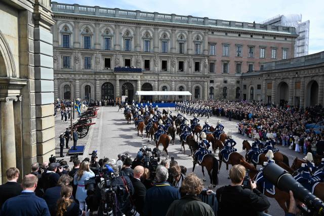 Mmebers of the Swedish royal family follow the changing of the guard from the balcony at the Royal Palace in Stockholm, Sweden, on April 30, 2026, during celebrations to mark the 80th birthday of Sweden's King Carl XVI Gustaf. (Photo by Jonathan Nackstrand / AFP)