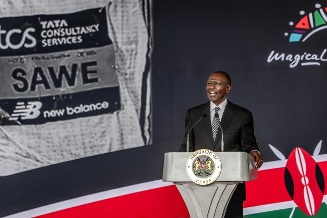 Kenya's President William Ruto delivers a speech on stage during a congratulatory ceremony for Kenyan marathon runner Sabastian Sawe at State House in Nairobi, on April 30, 2026, to celebrate his victory at the London Marathon after breaking a historic world record. Sabastian Sawe became the first man to run under two hours for a marathon in race conditions thanks to extraordinary talent, a punishing training regime, and the lightest shoes in history. In London on April 26, 2026, the 31-year-old Kenyan achieved one of sport's milestones, ranking alongside Roger Bannister's first sub-four minute mile in 1954. (Photo by Luis TATO / AFP)