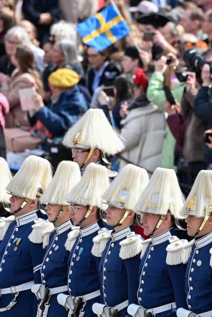 Members of the royal guard line up at the Royal Palace in Stockholm, Sweden, on April 30, 2026, during celebrations to mark the 80th birthday of Sweden's King Carl XVI Gustaf. (Photo by Jonathan Nackstrand / AFP) / ALTERNATIVE CROP