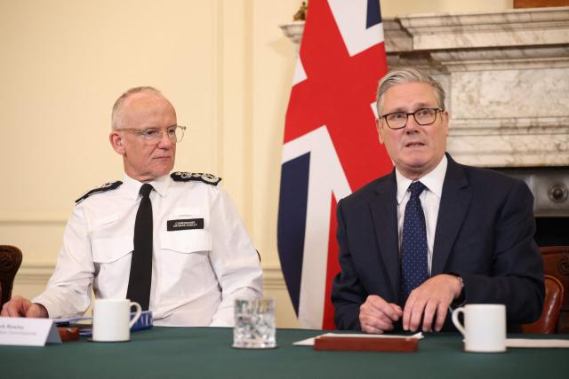 Britain's Prime Minister Keir Starmer (R) and Metropolitan Police Commissioner Mark Rowley (L) attend a meeting of criminal justice agencies following the Golders Green attack the day before, in Downing Street in central London on April 30, 2026. The UK government on April 30 announced an extra 25 million pound (33 million USD) for security outside synagogues and schools, a day after two Jews were stabbed in the latest attack on the community. (Photo by Dan Kitwood / POOL / AFP)