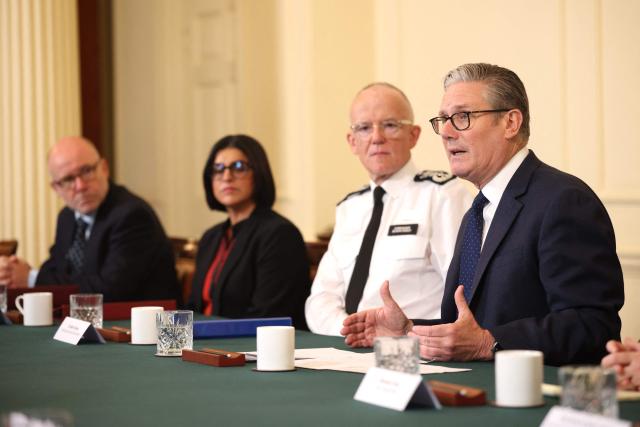 (L to R) Britain's Attorney General Richard Hermer, Britain's Home Secretary Shabana Mahmood, Metropolitan Police Commissioner Mark Rowley and Britain's Prime Minister Keir Starmer attend a meeting of criminal justice agencies following the Golders Green attack the day before, in Downing Street in central London on April 30, 2026. The UK government on April 30 announced an extra 25 million pound (33 million USD) for security outside synagogues and schools, a day after two Jews were stabbed in the latest attack on the community. (Photo by Dan Kitwood / POOL / AFP)