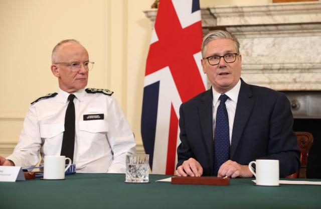 Britain's Prime Minister Keir Starmer (R) convenes a meeting of criminal justice agencies as Metropolitan Police Commissioner Mark Rowley (L) looks on, following the Golders Green attack the day before, in Downing Street in central London on April 30, 2026. The UK government on April 30 announced an extra 25 million pound (33 million USD) for security outside synagogues and schools, a day after two Jews were stabbed in the latest attack on the community. (Photo by Dan Kitwood / POOL / AFP)