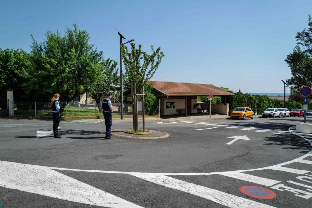 Police officers patrol by the school of the village of Lucenay, central France, on April 30, 2026. A man who had already been charged in 2025 with the rape of young boys in the Beaujolais region was charged again in April 2026 following the discovery of further victims – 34 in total, aged between three and nine – the public prosecutor’s office in Villefranche-sur-Saone said on April 29, 2026, confirming a report in the French newspaper Le Monde. The 40-year-old suspect was charged with rape and sexual assault of minors under the age of 15, as well as the possession and storage of pornographic images of minors, prosecutor Laetitia Francart told AFP. The offences took place between 2020 and 2024 in the village of Lucenay, in the heart of the Beaujolais region, around 30 km north of Lyon. (Photo by OLIVIER CHASSIGNOLE / AFP)
