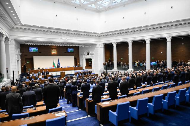 Members of parliament take an oath during the first session of the parliament following the snap election, in Sofia on April 30, 2026. Progressive Bulgaria coalition's leader and former President Rumen Radev, an EU critic who wants renewed dialogue with Russia, won an absolute majority in the parliamentary elections held on April 19, 2026, and is set to become head of government. (Photo by Nikolay DOYCHINOV / AFP)