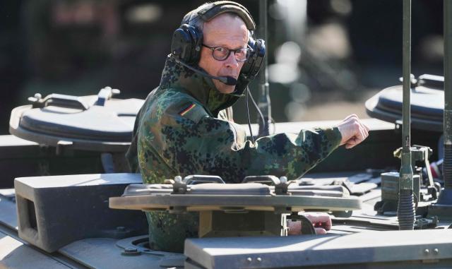 German Chancellor Friedrich Merz is driven in a GTK Boxer tank at the German army barracks in Munster, northern Germany, on April 30, 2026, as they visit the troops of the German Army.  (Photo by Markus Schreiber / POOL / AFP)