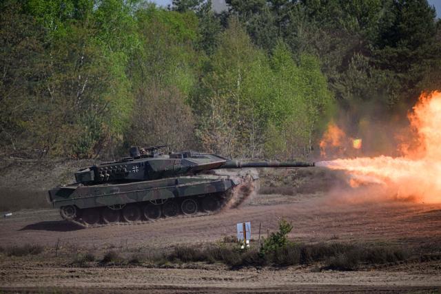 A Leopard 2A6 tank fires during a demonstration for the German Chancellor visiting the troops of the German Army (Bundeswehr) at the German armed forces' barracks in Munster, northern Germany, on April 30, 2026. (Photo by DANIEL REINHARDT / AFP)