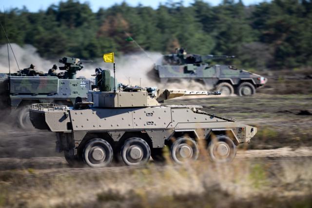 Boxer tanks of the German army operate during a presentation at the German army barracks while the German Chancellor (unseen) visits the troops of the German Army in Munster, northern Germany, on April 30, 2026. (Photo by DANIEL REINHARDT / AFP)