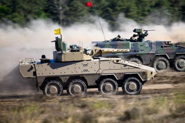 Boxer tanks of the German army operate during a presentation at the German army barracks while the German Chancellor (unseen) visits the troops of the German Army in Munster, northern Germany, on April 30, 2026. (Photo by DANIEL REINHARDT / AFP)