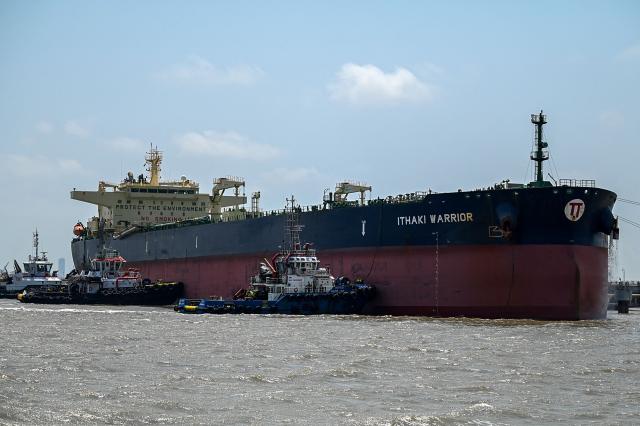 The Greece-flagged oil tanker Ithaki Warrior is seen docked at an offloading terminal along the coast in Mumbai on April 30, 2026. India, the world's third-largest oil buyer, normally sources about half of its crude through the Strait of Hormuz, a vital waterway that has seen only a trickle of traffic since the United States and Israel launched attacks on Iran on February 28. (Photo by Punit PARANJPE / AFP)