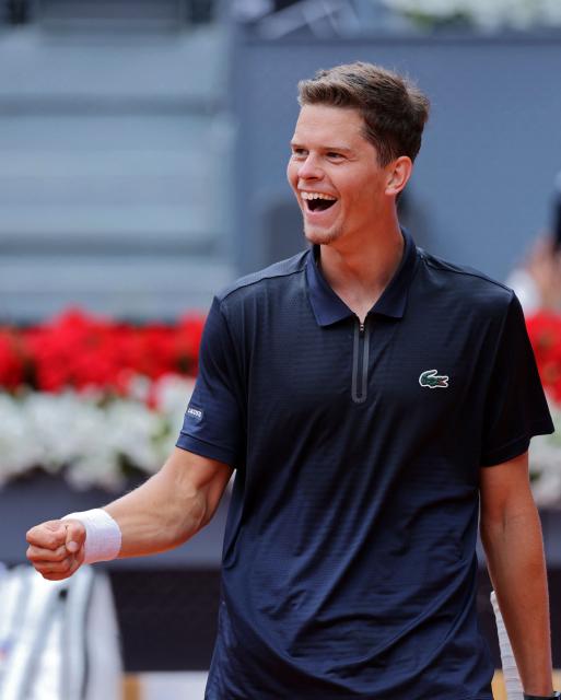 Belgium's Alexander Blockx celebrates beating Norway's Casper Ruud during their 2026 ATP Tour Madrid Open tennis tournament quarter-final singles match at the Caja Magica in Madrid, on April 30, 2026. (Photo by Thomas COEX / AFP)