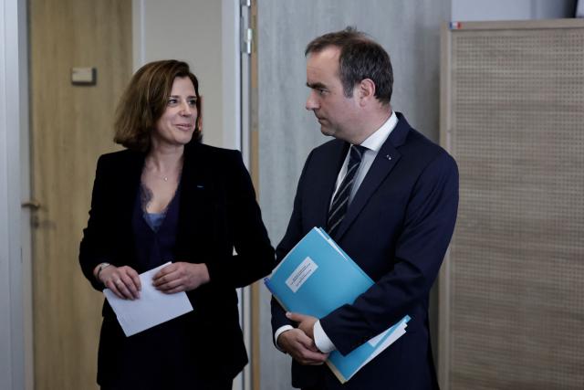 France's Prime Minister Sebastien Lecornu (R) speaks with ANTS Managing Director Julie Mercier during a visit to the headquarters of the French National Agency for Secure Documents (Agence nationale des titres securises - ANTS), in Paris, on April 30, 2026. The National Agency for Secure Documents suffered a massive data breach on 15 April, 2026. The data of nearly 12 million individuals and businesses had been affected by the attack. (Photo by STEPHANE DE SAKUTIN / AFP)