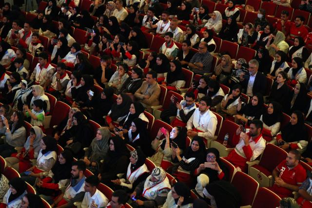 People watch as permanent conductor of Iran's National Music Orchestra, Homayoun Rahimian (unseen) leads a performance on the occasion of national "Persian Gulf" day at the Vahdat Hall in Tehran, on April 30, 2026. Iran's parliament speaker Mohammad Bagher Ghalibaf vowed on April 30 that his country's control over the strategic Strait of Hormuz would ensure a future without US presence in the area. "Today, by managing the Strait of Hormuz, Iran will provide itself and its neighbours with the precious blessing of a future free from American presence and interference," said Ghalibaf in a post on X to mark the national "Persian Gulf" day. (Photo by AFP)