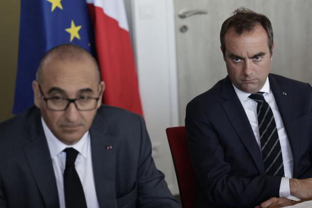 France's Prime Minister Sebastien Lecornu (R) and France's Interior Minister Laurent Nunez attend a visit to the headquarters of the French National Agency for Secure Documents (Agence nationale des titres securises - ANTS), in Paris, on April 30, 2026. The National Agency for Secure Documents suffered a massive data breach on 15 April, 2026. The data of nearly 12 million individuals and businesses had been affected by the attack. (Photo by STEPHANE DE SAKUTIN / AFP)