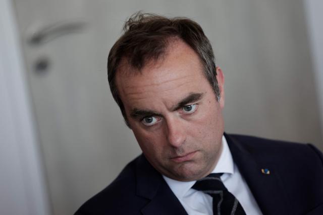 France's Prime Minister Sebastien Lecornu (R)  attends a visit to the headquarters of the French National Agency for Secure Documents (Agence nationale des titres securises - ANTS), in Paris, on April 30, 2026. The National Agency for Secure Documents suffered a massive data breach on 15 April, 2026. The data of nearly 12 million individuals and businesses had been affected by the attack. (Photo by STEPHANE DE SAKUTIN / AFP)