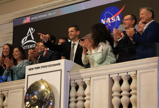 NASA Administrator Jared Isaacman (C), joined by President of NYSE Group Lynn Martin (C-R), along with NASA leadership, gestures as he rings the opening bell of the New York Stock Exchange, on April 30, 2026, in New York, New York. (Photo by TIMOTHY A. CLARY / AFP)