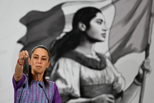 Mexico's President Claudia Sheinbaum points towards journalists during her daily press conference at the Palacio Nacional in Mexico City on April 30, 2026. Mexican federal prosecutors said on April 29 that they will open an investigation into the governor of Sinaloa state after US authorities brought narcotrafficking charges against Ruben Rocha Moya and several associates. (Photo by YURI CORTEZ / AFP)